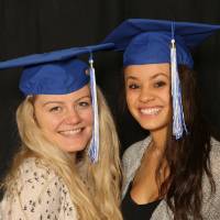 two soon to be graduates smiling for a picture